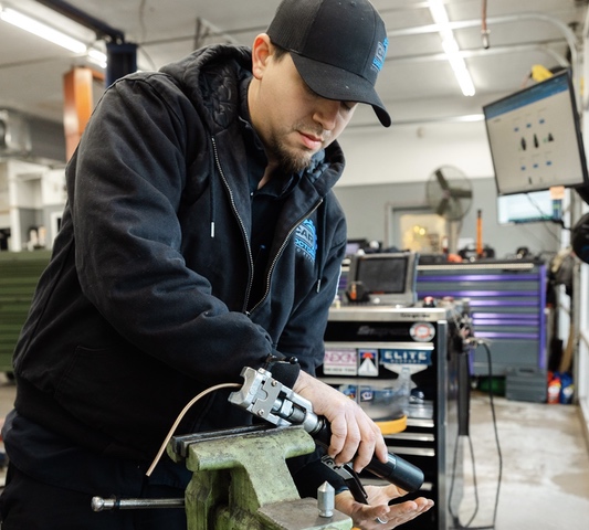 Car Doctors Auto Mechanic repairing car parts in our shop.